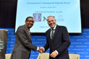 At Fintech Week, IIEL Faculty Director Chris Brummer (left) shakes hands with Christopher Woolard, Executive Board Member and Director of Strategy & Competition, Financial Conduct Authority United Kingdom.