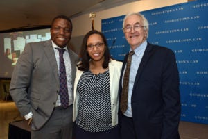 Professor Rick Roe (right), who is retiring after more than 30 years directing Georgetown Law's Street Law Program, poses with Acting Director Charisma Howell and Street Law Student Alum Patrick Campbell (C'92)