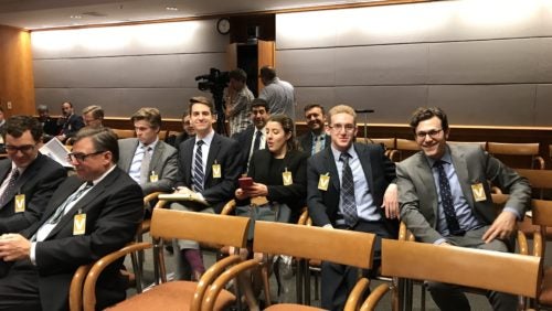 Clinical students seated in a meeting room at the FCC. 