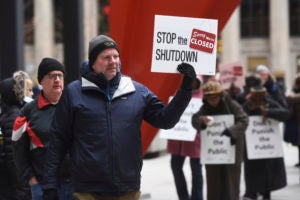 As federal employees rally against the government shutdown (Joe Lewnard/Daily Herald via AP), Georgetown Law professors including Professor from Practice Timothy Westmoreland are working the relevant law into their classes.