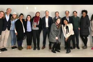  April McClain-Delaney (L'89) and John Delaney (L'88)(left) with family and Georgetown Law students/faculty in Dilley, Texas, in early January, helping families seeking asylum. Fourth from left: Silvia Calderon (L'19), Nikki Endsley (L'19), Sabiya Ahamed (L'20), Austin Rose (L'21), Amelia Theisen (L'19), Professor Brian Wolfman, Atid Kimelman (L'19), Desiree Luckey (L'19), Ana Builes (L'21); (front row) Kristen Blosser (L'20) and Dilley Pro Bono staff. (Photo above courtesy of the Delaneys; before meeting with asylum seekers, students participated in an orientation, below; photos by Darren Abate/AP Images for Georgetown Law.)