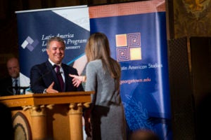 Ana Elena Khouri (LL.M.’19), president of Georgetown Law’s Colombian Law Students Association, welcomes Colombian President Iván Duque Márquez (MPM’07) in Georgetown University's Gaston Hall, as Law Center Dean William M. Treanor looks on.