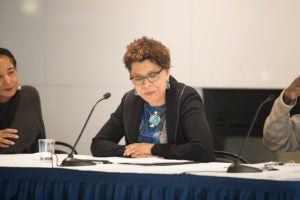 Professor Sheryll Cashin, seated between Professor Jill Morrison and Professor Paul Butler, at "Can I Live? Black Women's Lives in America" at Georgetown Law on February 11.