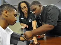 Medical student with high-school students at the Anacostia High School health clinic