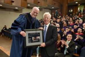 Dean William M. Treanor presents a gift to Scott K. Ginsburg (L'78).