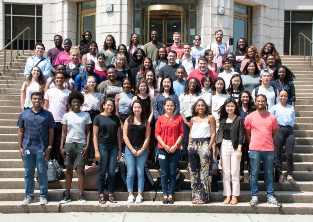 The 2018-2019 RISE Fellows Cohort standing on the McDonough Hall steps. Students are all smiling and wearing various casual clothes.