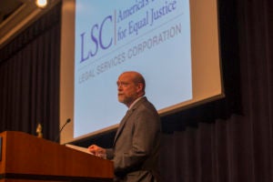 Dean William M. Treanor welcomes attendees at the Legal Service Corporation's Forum on Increasing Access to Justice, in Georgetown Law's Hart Auditorium on April 9.