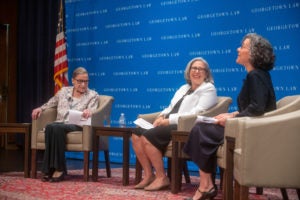 Justice Ruth Bader Ginsburg, onstage in Hart Auditorium, chats with Ruthanne Deutsch and Adjunct Professor Dori Bernstein.