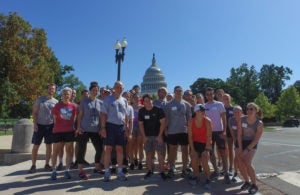 Professor Bob Thompson, Barb Moulton and Laura DeMouy take students on a jog on the Mall.