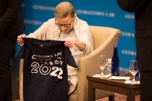 Justice Ruth Bader Ginsburg receives a Georgetown Law Class of 2022 t-shirt.