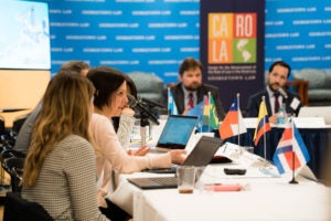 Participants at Latin America workshop sitting around a table.