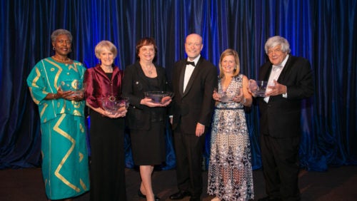Paul R. Dean Awardees Don Burris, Devarieste Curry, Beth McCann, Ann Beth Stebbins and Drinan Awardee Barabara D. Underwood pose for photo with Dean Treanor.