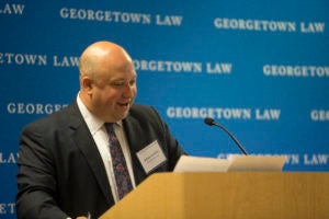 Professor Adam Levitin at podium.