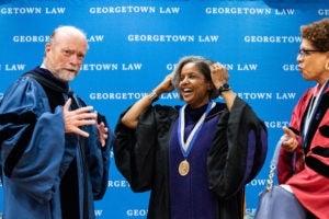 Dean William M. Treanor, Professor Sheila R. Foster and Professor Sheryll Cashin at Foster's installation ceremony