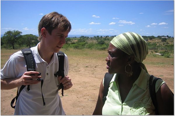 Student Advocate Nicolas Mitchell speaking with local attorney supervisor, Sibonelo Mdluli, in the field