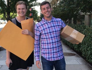 K Rheaume and M Caplan with boxes.