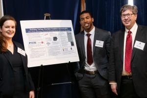 Rachel Wehr (L’20), Tech Law Scholar Kendall Spencer (L’20) and Professor Matt Blaze with the poster entitled: “Holding Vendor Machine Voters Accountable: How State Attorneys General Can Help Secure America’s Elections.”