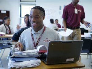 Legal Prep Charter Academy participant by computer.