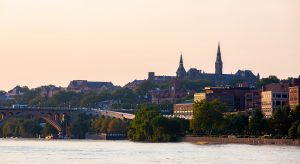 Photo of Georgetown University campus overlooking the river at sunset.