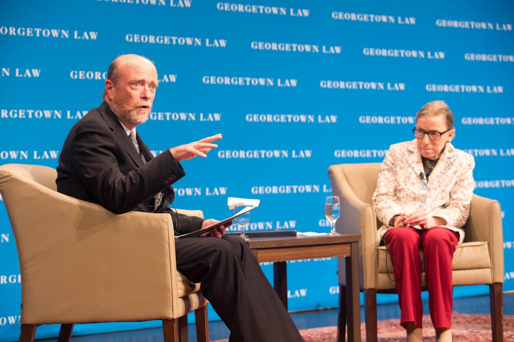 Dean Treanor with Ruth Bader Ginsburg on stage at Hart Auditoirum