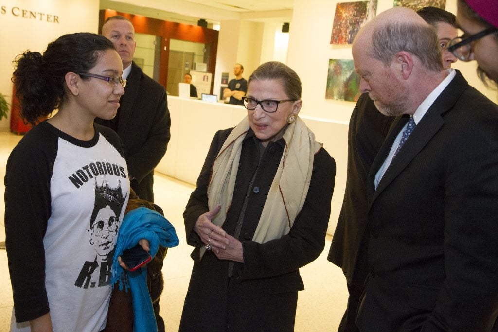 Ruth Bader Ginsburg, accompanied with Dean Treanor, meets with a student in Hotung Building.