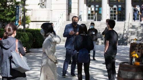 Professor Marty Lederman meets with students outside of the Edward Bennett Williams Law Library.