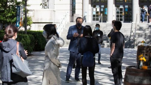 Professor Marty Lederman meets with students outside of the Edward Bennett Williams Law Library. 