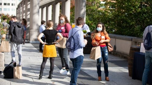 Students socializing outside of the Edward Bennett Williams Law Library.