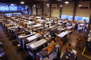 Several hundred inmates crowd the gymnasium at San Quentin prison in San Quentin, Calif. 