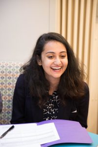 Prashasti Bhatnagar in the mobile health truck talking and smiling