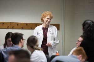 Eileen Moore speaking with students