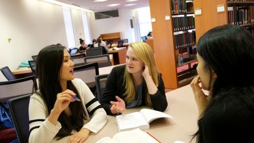 students working together in the law library