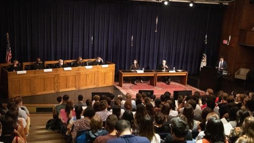 Faculty presented a moot court preview of an upcoming Supreme Court case. Left to right: “Justices” Professors Paul Smith, Paul Butler, Michael Seidman, Christy Lopez and Irving Gornstein, “Advocates” Dean Erica Hashimoto and Professor Michael Gottesman and master of ceremonies Dean Mitch Bailin. 