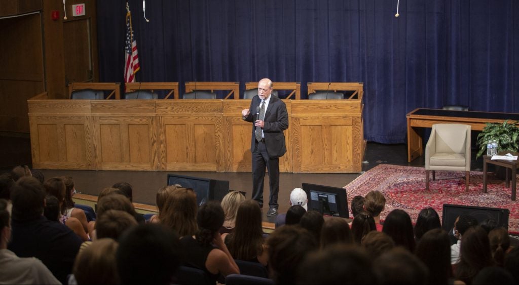 Dean William M. Treanor addresses the new 1L class in Hart Auditorium.