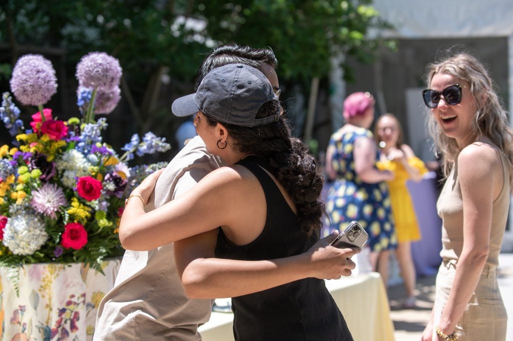 Two alumni embrace at the Celebration Weekend brunch