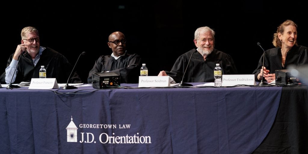 Four Georgetown Law professors participating in a Faculty Moot presentation