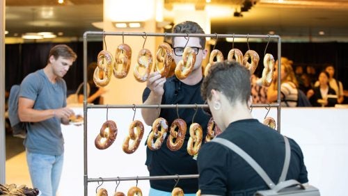 Students select snacks during an orientation reception