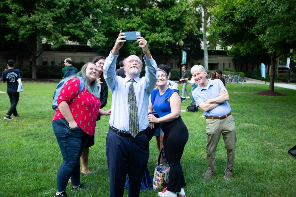 Dean Treanor taking a selfie with others