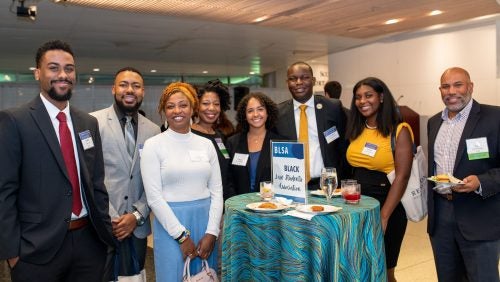 A group of alumni and students at the Reunion Affinity Mixer