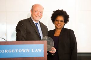 Two faculty members smiling at the faculty awards luncheon