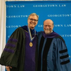 Prof. Gregory Klass standing with Dean William M. Treanor