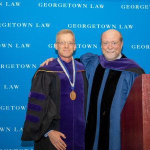 Prof. Howard Shelanski standing with Dean William M. Treanor