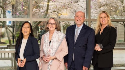 (L-R) Judge Pamela K. Chen, L’86, Patricia Mullahy Fugere, C’81, L’84, Dean William M. Treanor and Michele Johnson, L’98 smile for the camera with their awards.