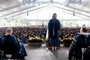 A view from the Commencement Day stage. L-R: Dean William M. Treanor, commencement speaker Savannah Guthrie, L'02, H'23, President John J. DeGioia - and before them, the Georgetown Law Class of 2023.