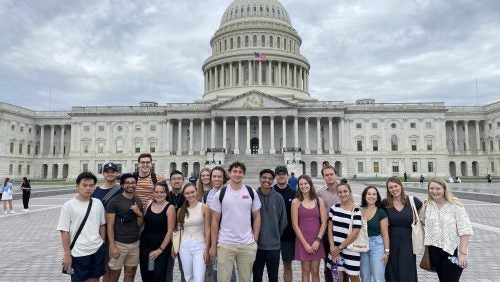 Students standing in front of the U.S. Capitol Building