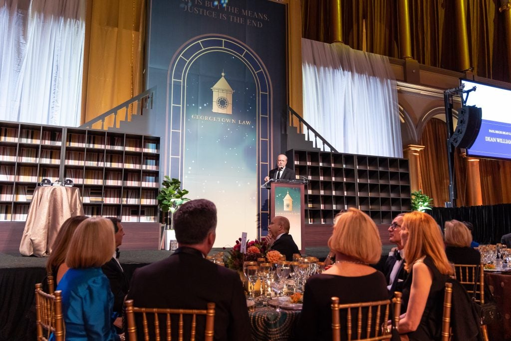The stage of the reunion gala with Dean William Treanor at the podium