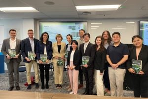 Prof. Jennifer Hillman, center, with students whose work became a new book on trade and climate change.