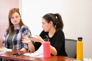 Students at a lunch-and-learn event ask for advice about their career paths.