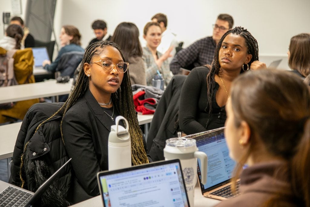 A small group of students in the course "Regulating Online Speech in the Age of Social Media" engage in discussion.