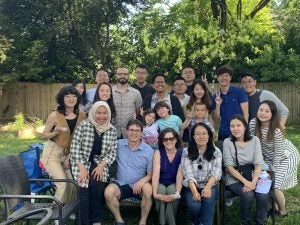 Horowitz (center) poses with LL.M. students at a barbecue at his home.